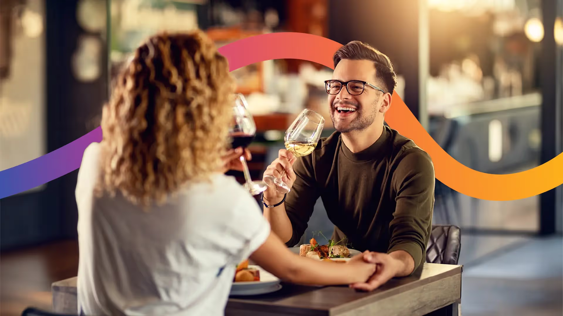 A couple out for dinner on a patio drinking wine. A wide flowing rainbow gradient band intertwines them.