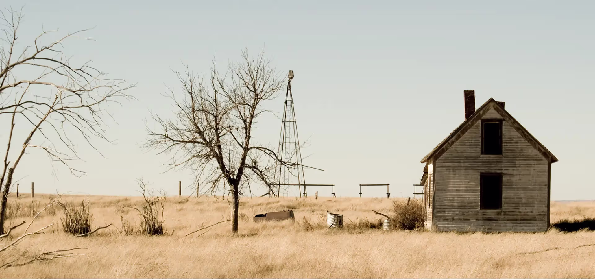 An abandoned farm homestead on parched land in Southern Alberta. 