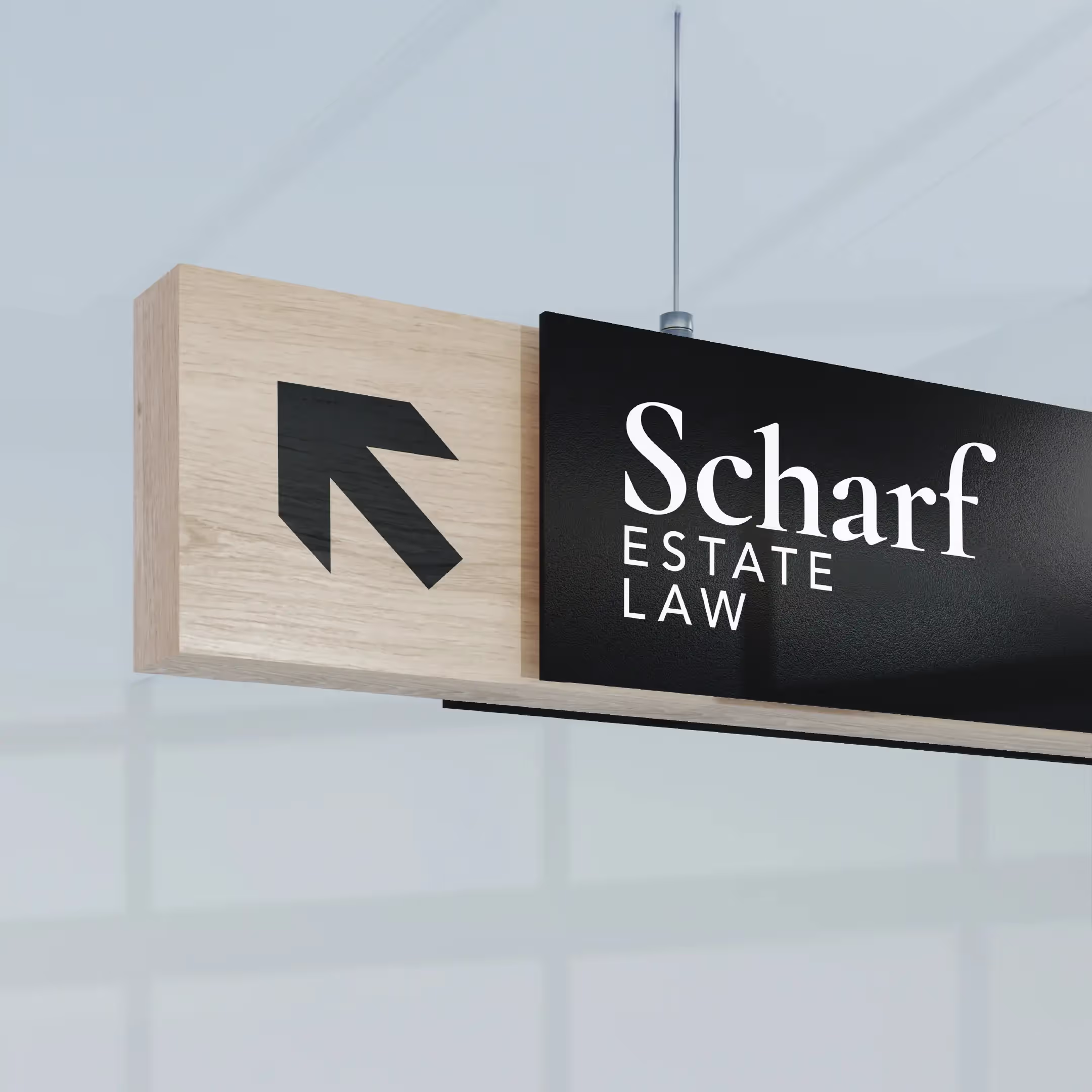 An interior wayfinding sign that shows the direction to the Scharf Estate Law offices.